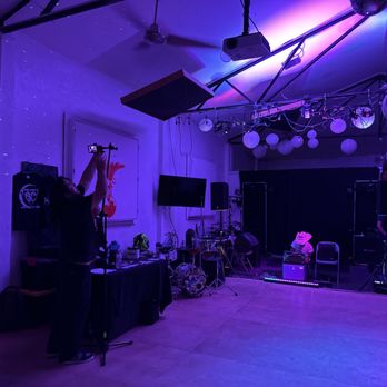 Juno - a large room with a stage set up for a concert - Breweries Near Me - Albuquerque, New Mexico
