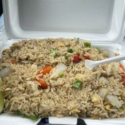 Basil fried rice (red and green peppers, green and white onion, tomatoes, eggs, basil, rice, and slice of lime)