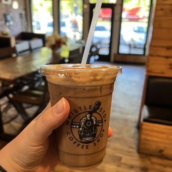 Whistle Stop Coffee & Mercantile - a hand holding a cup of coffee - Coffee & Tea Near Me - Lees Summit, Missouri Whistle Stop Coffee & Mercantile - a hand holding a cup of coffee - Coffee & Tea Near Me - Lees Summit, Missouri