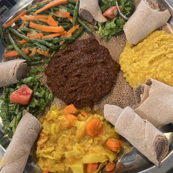 Addis Ethiopian - Our platter from the top clockwise; #17, #20, #23, #19 - Ethiopian Near Me - San Diego, California