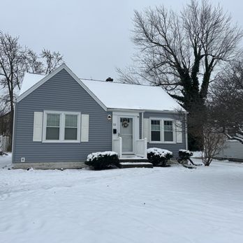 McCarthy Remodeling - We finally finished this house. It has blue vinyl siding and a white aluminum trim. - Siding Near Me