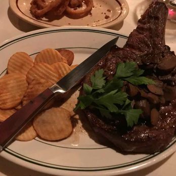 Eastwood - a plate of steak with chips and a knife - Salad Near Me - Ligonier, Pennsylvania