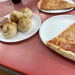 Peter's New York Pizzeria - Two slices of cheese pizza and garlic knots.