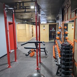 HOTWORX - Media - The FX Zone with our state-of-the-art infrared saunas in the background.