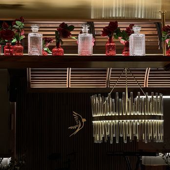 Sparrow Italia - Bar with stage in the background - Italian Near Me - Miami, Florida Sparrow Italia - Bar with stage in the background - Italian Near Me - Miami, Florida