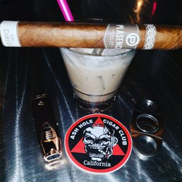 a cigar and a drink