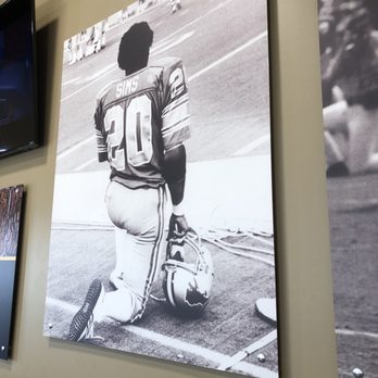 Billy Sims BBQ - a black and white photograph of a football player - Barbeque Near Me - Hays, Kansas