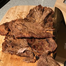 cut up meat on a cutting board