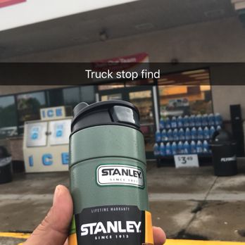 Flying J - a hand holding a stanley's travel mug in front of a store - Gas Stations Near Me - New Milford, Pennsylvania Flying J - a hand holding a stanley's travel mug in front of a store - Gas Stations Near Me - New Milford, Pennsylvania