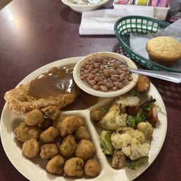 Pork chops, pinto beans, grilled veggies, fried okra and a corn bread muffin Pork chops, pinto beans, grilled veggies, fried okra and a corn bread muffin