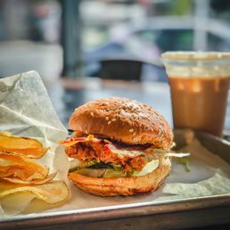a burger and chips on a tray