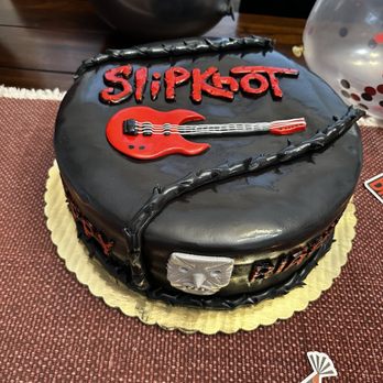 Erotic Bakery - a cake with a guitar on it - Bakeries Near Me