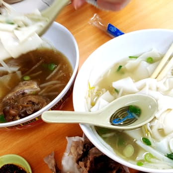 Bo Ky - Same exact dish (country style duck with flat rice noodles) but one bowl is completely lacking in flavor with too much noodles (right side) - Chinese Near Me - New York, New York
