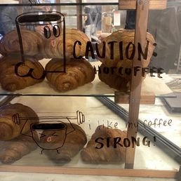 Cute doodles on the pastry display Cute doodles on the pastry display