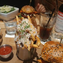 Garlic Parmesan fries, Californication burger and green salad Garlic Parmesan fries, Californication burger and green salad