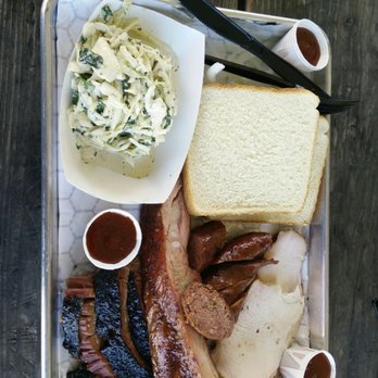 CorkScrew BBQ - A sampling of everything including wet brisket, smoked sausage, smoked turkey, and pork ribs. - Barbeque Near Me - Spring, Texas