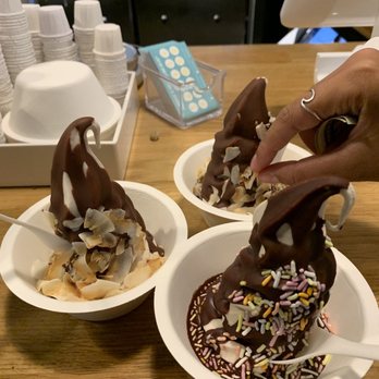 Eb & Bean - All macadamia ice cream with chocolate hazelnut shell, back two have coconut chips and front with rainbow sprinkles - Ice Cream & Frozen Yogurt Near Me - Portland, Oregon