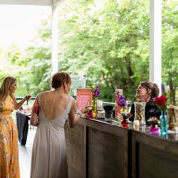 A Liquid Catering bartender servings guests at an event