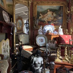 Entryway of A Galerie, with art, furniture, & mirrors on display. Entryway of A Galerie, with art, furniture, & mirrors on display.