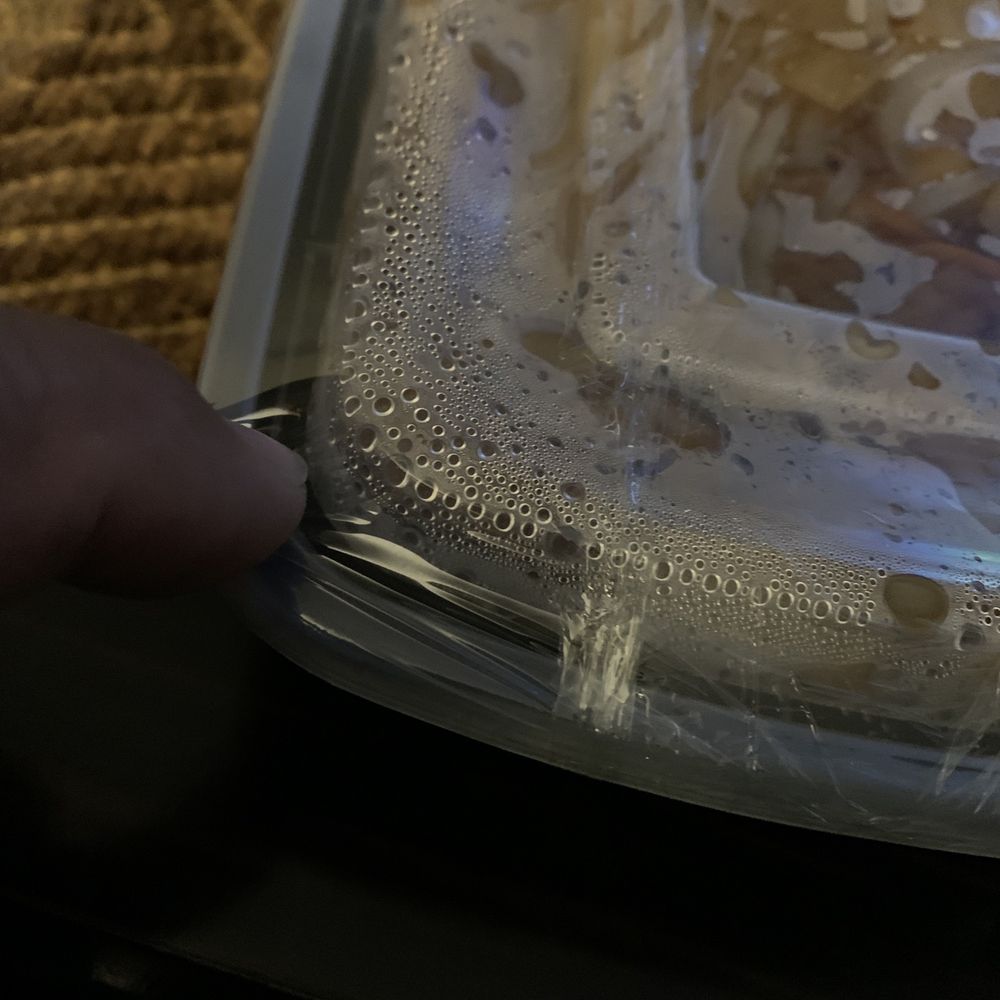 The container was wrapped with plastic to prevent leaks. The container was wrapped with plastic to prevent leaks.