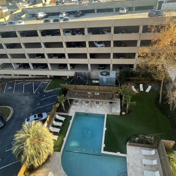 Senate Plaza - Daytime view of the pool and parking garage. - Apartments Near Me - Columbia, South Carolina