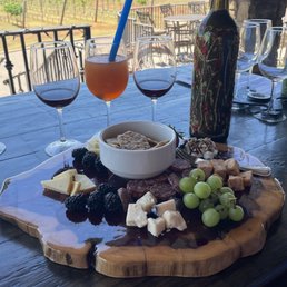 Beautiful outdoor patio with wine and charcuterie board. Beautiful outdoor patio with wine and charcuterie board.