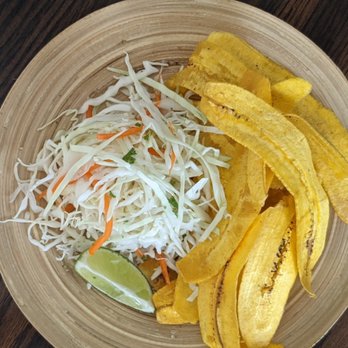 MayoKechu - Tajadas is one of our side dishes, served here with cabbage salad and your choice of mayokechu sauce. - Food Trucks Near Me