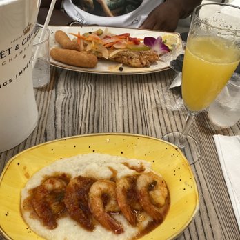 Dukunoo - Shrimp & grits & fried fish with festival and mimosa. - Caribbean Near Me - Miami, Florida Dukunoo - Shrimp & grits & fried fish with festival and mimosa. - Caribbean Near Me - Miami, Florida