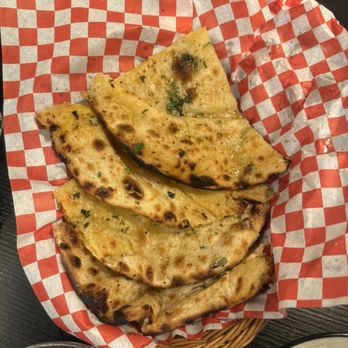 Ticca Tikka Indian Cuisine - Cheesy Naan with Garlic - Indian Near Me - Oceanside, California Ticca Tikka Indian Cuisine - Cheesy Naan with Garlic - Indian Near Me - Oceanside, California