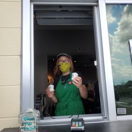 Barista handing me my babies pupacinos