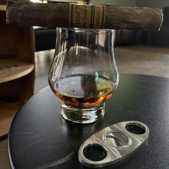 21 Degrees Cigar Lounge - a glass of whiskey and a cigar cutter - Tobacco Shops Near Me - Scottsdale, Arizona 21 Degrees Cigar Lounge - a glass of whiskey and a cigar cutter - Tobacco Shops Near Me - Scottsdale, Arizona