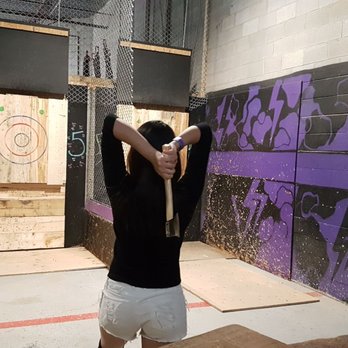 BATL Axe Throwing - a man throwing a bat - Axe Throwing Near Me - Vaughan, Ontario