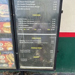 a menu on the side of a building