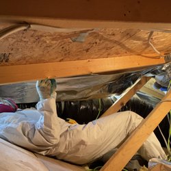 LV Attic Pros - LV Attic Pros employee installing radiant barrier.