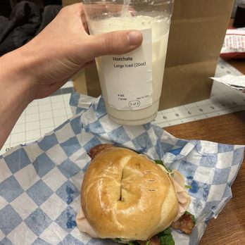 Fat Bagels - Wrong size horchata and uncut bagel sandwich - Bagels Near Me - Flagstaff, Arizona