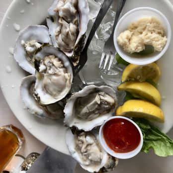 Sunset Cafe Waterfront Grill & Bar - half dozen raw oysters - Seafood Near Me - Cocoa Beach, Florida Sunset Cafe Waterfront Grill & Bar - half dozen raw oysters - Seafood Near Me - Cocoa Beach, Florida