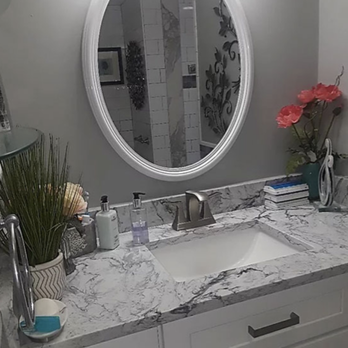 Contracting Services 1 - a bathroom with a sink and mirror - Flooring Near Me - Boynton Beach, Florida