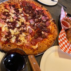 Route 66 Pizza - Half Luau and half Brutus! Our fave pizza restaurant. Great staff. Fun ambiance inside too