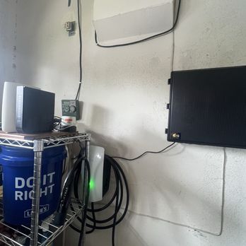 EJ Electric - After installation. Hiding behind storage shelf. Exactly how I pictured and wanted. No blockage despite bulky faceplate. - Electricians Near Me