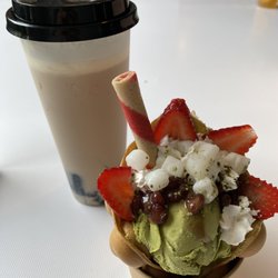 Large roasted oolong bubble tea and matcha red bean bubble waffle with strawberries and mochi