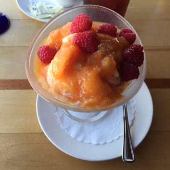 Anthony's at Sinclair Inlet - Peach ice cream topped with peaches and raspberries. - Seafood Near Me - Bremerton, Washington Anthony's at Sinclair Inlet - Peach ice cream topped with peaches and raspberries. - Seafood Near Me - Bremerton, Washington