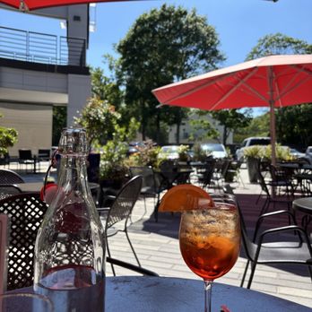 Apres Diem - Patio area, Aperol spritz, table water - Bars Near Me - Atlanta, Georgia Apres Diem - Patio area, Aperol spritz, table water - Bars Near Me - Atlanta, Georgia