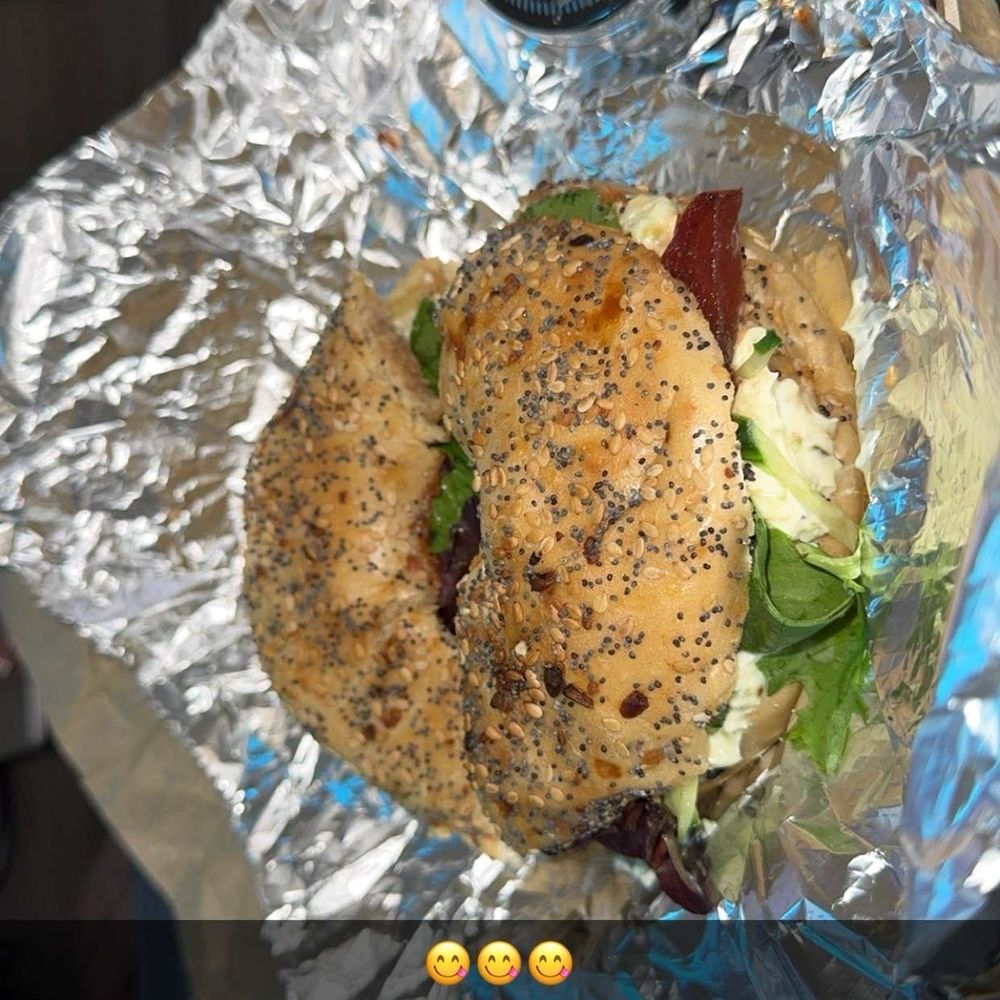 Grounded All Day Cafe - Vineyard bagel with three alarm pepper cream cheese spread - Coffee & Tea Near Me - Lexington, Kentucky