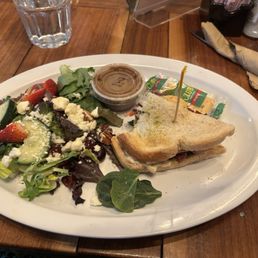 AVACADO BLT WITH MIXED GREENS Alreddy House Side Salad, topped with craisins, feta, halved cucumbers, and strawberries