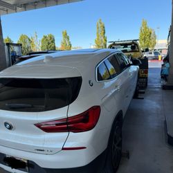 Tony's Towing - Car being towed.