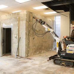 Dunk Disposal - Dunk Disposal owner doing an demolition job removing an old bank vault using an excavator jack machine to break up the concrete in GTA