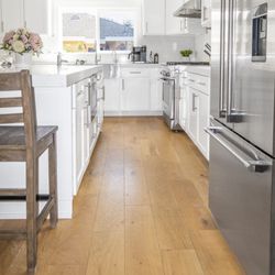 Reystone Construction - Open-concept kitchen -- stainless steel appliances, recessed lighting, hardwood throughout.