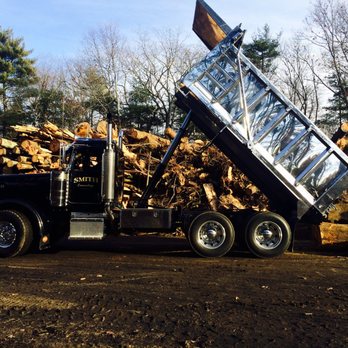 Smith & Sons - a dump truck dumping wood - Septic Services Near Me - Marshfield, Massachusetts Smith & Sons - a dump truck dumping wood - Septic Services Near Me - Marshfield, Massachusetts