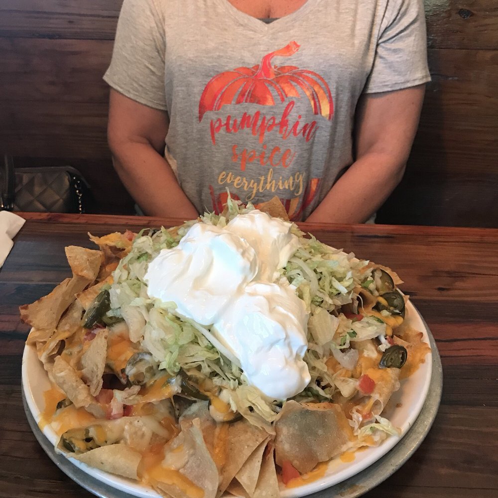 Miller's Ale House - Absolutely the largest nacho platter I've seen. This is not camera trickery- it's gigantic! - American Near Me - Jacksonville, Florida Miller's Ale House - Absolutely the largest nacho platter I've seen. This is not camera trickery- it's gigantic! - American Near Me - Jacksonville, Florida