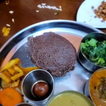 Spicy Nepal - Dhindo with Goat. Unique sour dish and a fun spin on a thali - Himalayan/Nepalese Near Me - Sunnyside, New York Spicy Nepal - Dhindo with Goat. Unique sour dish and a fun spin on a thali - Himalayan/Nepalese Near Me - Sunnyside, New York